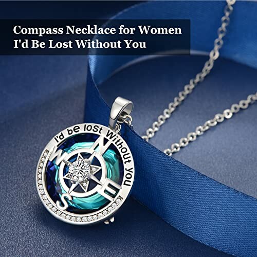 Compass necklace with 'I'd Be Lost Without You' inscription.