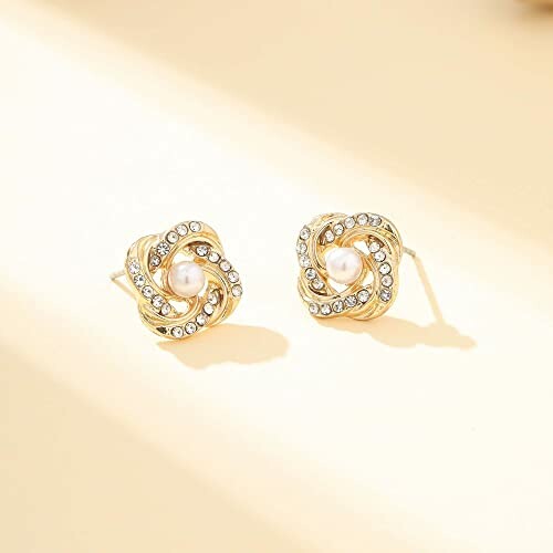 Gold stud earrings with pearls and crystals